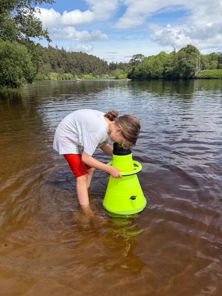 child using a bathyscope on the spey
